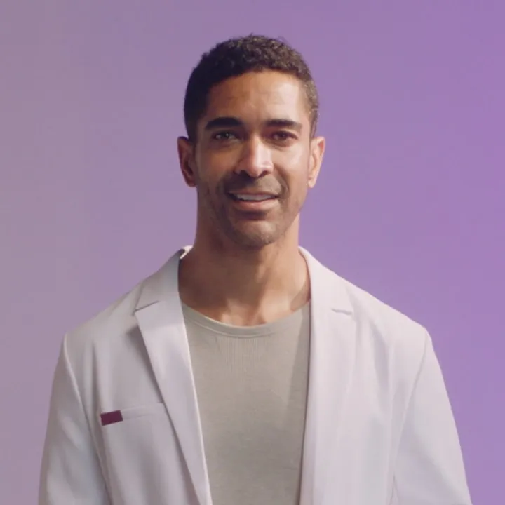 A physician with a purple background