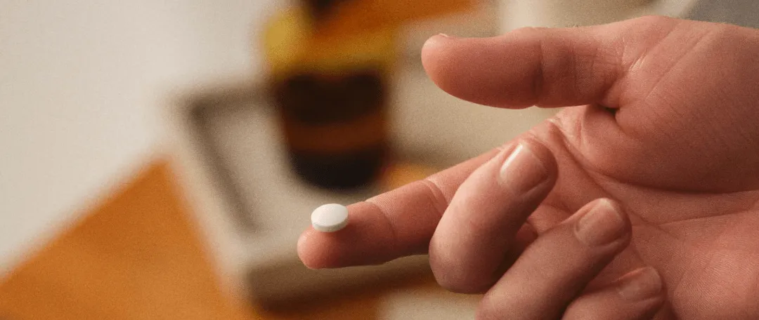 pill on a finger